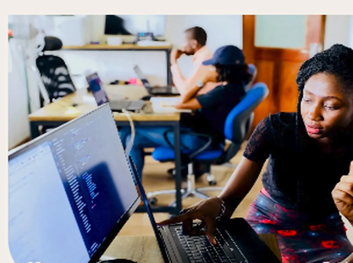 Students collaborating around computers